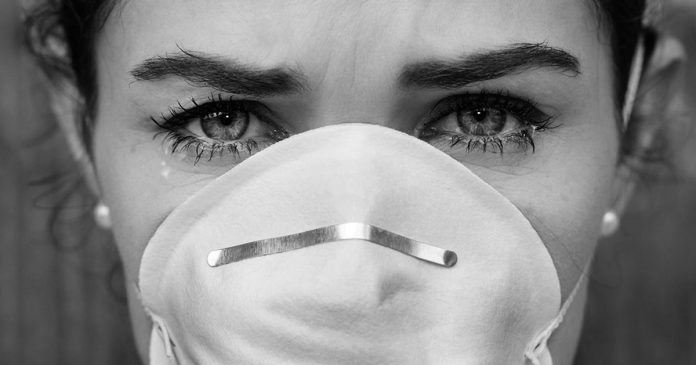 Close-up woman wearing a face mask